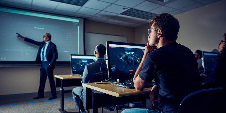 photo of a student sitting in a cybersecurity class