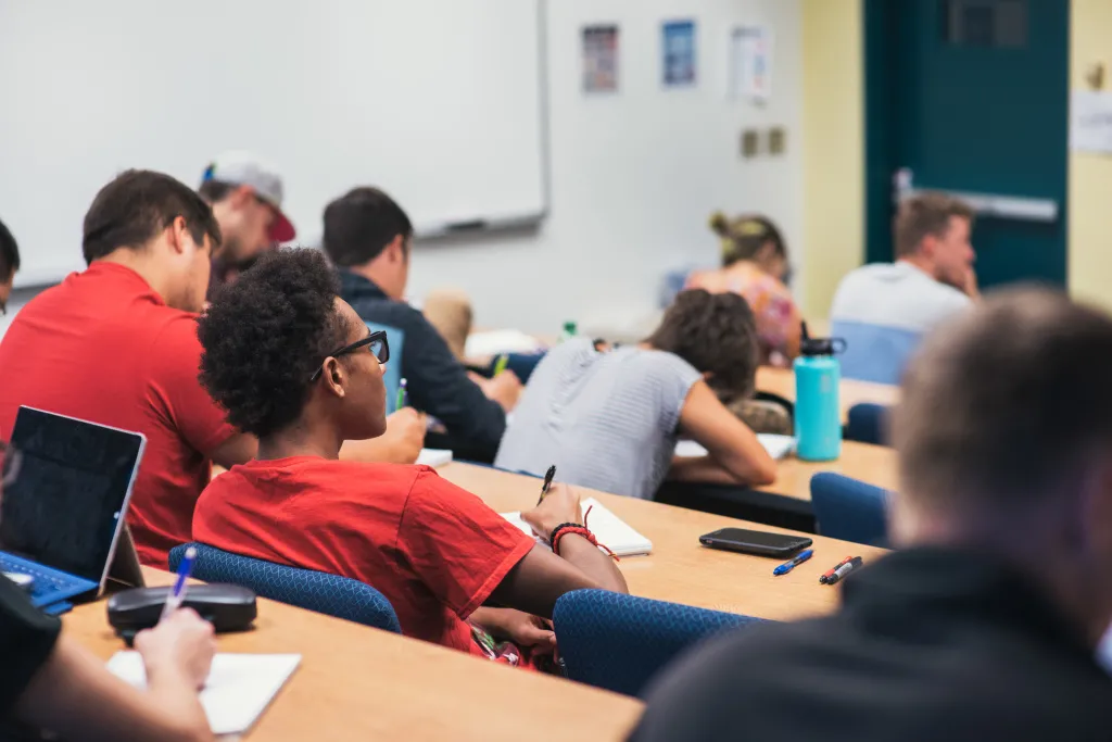 students taking notes in a classroom