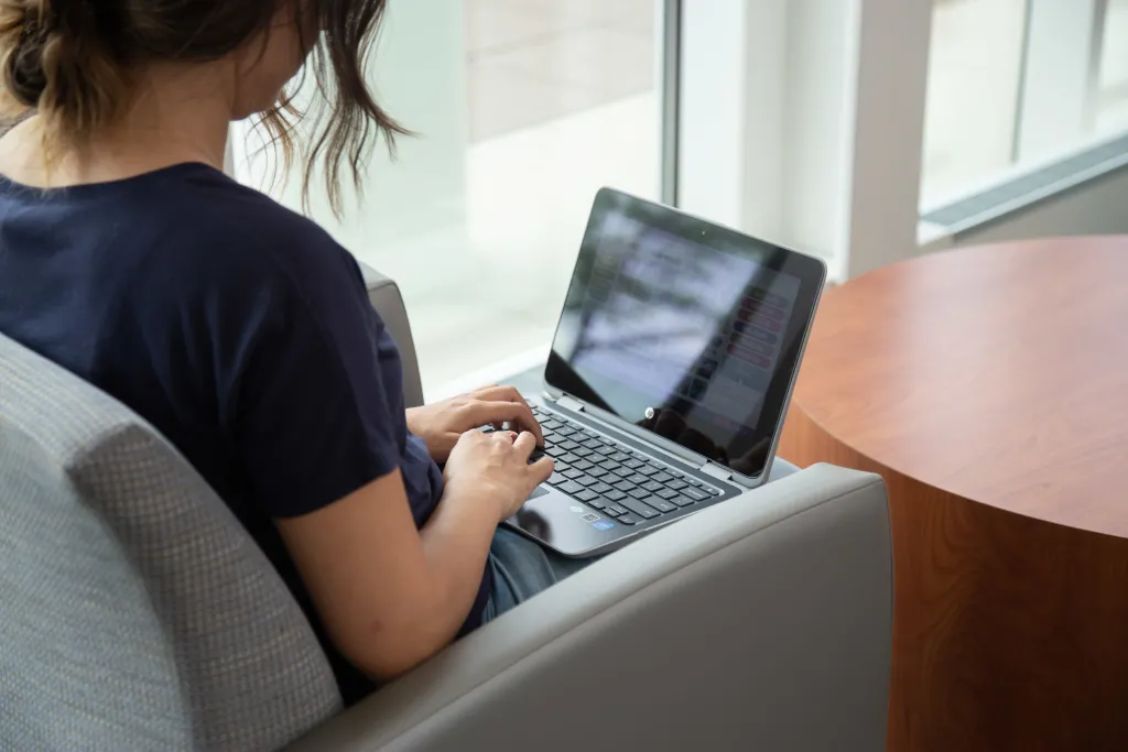 student woking on laptop