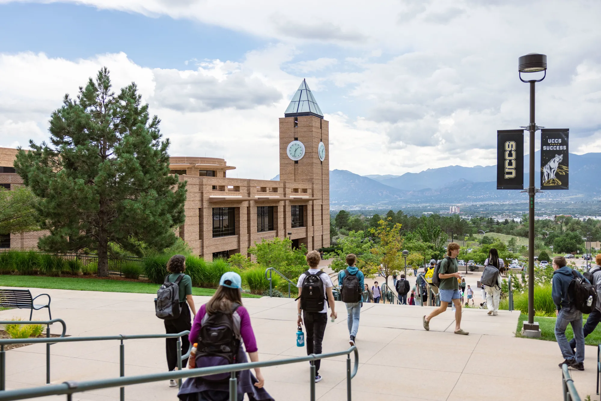 students walking in front of campus