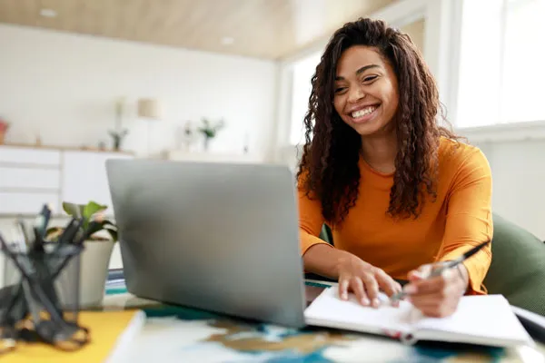 Woman studying in front of a laptop computer
